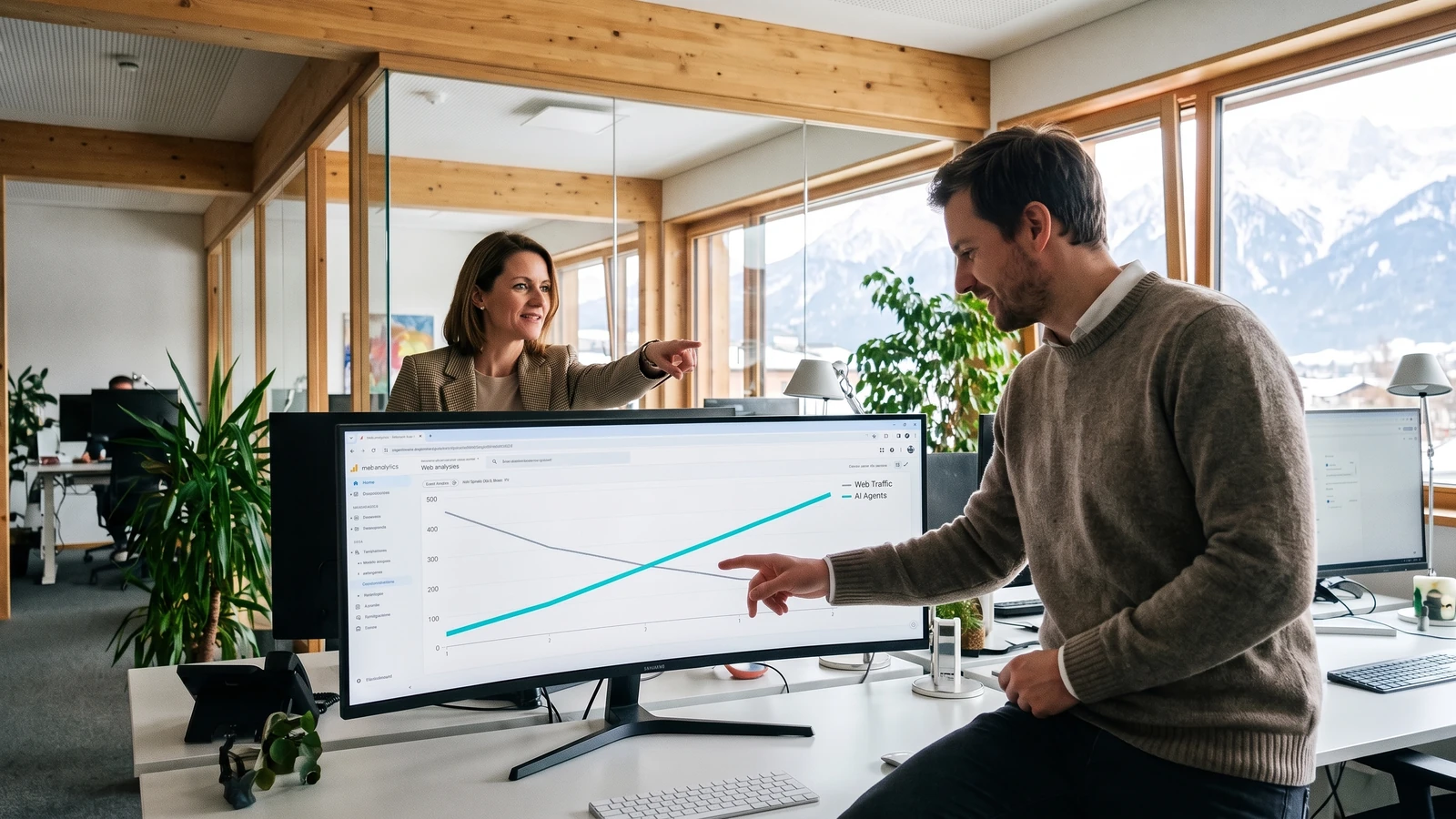 In the bright office of a Tyrolean hotel business, the marketing manager and a colleague point at a monitor where a line for web traffic falls and a line for AI agents rises